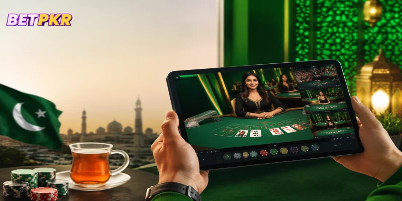 A close-up of a tablet screen showcasing live casino dealer games on an online betting platform.